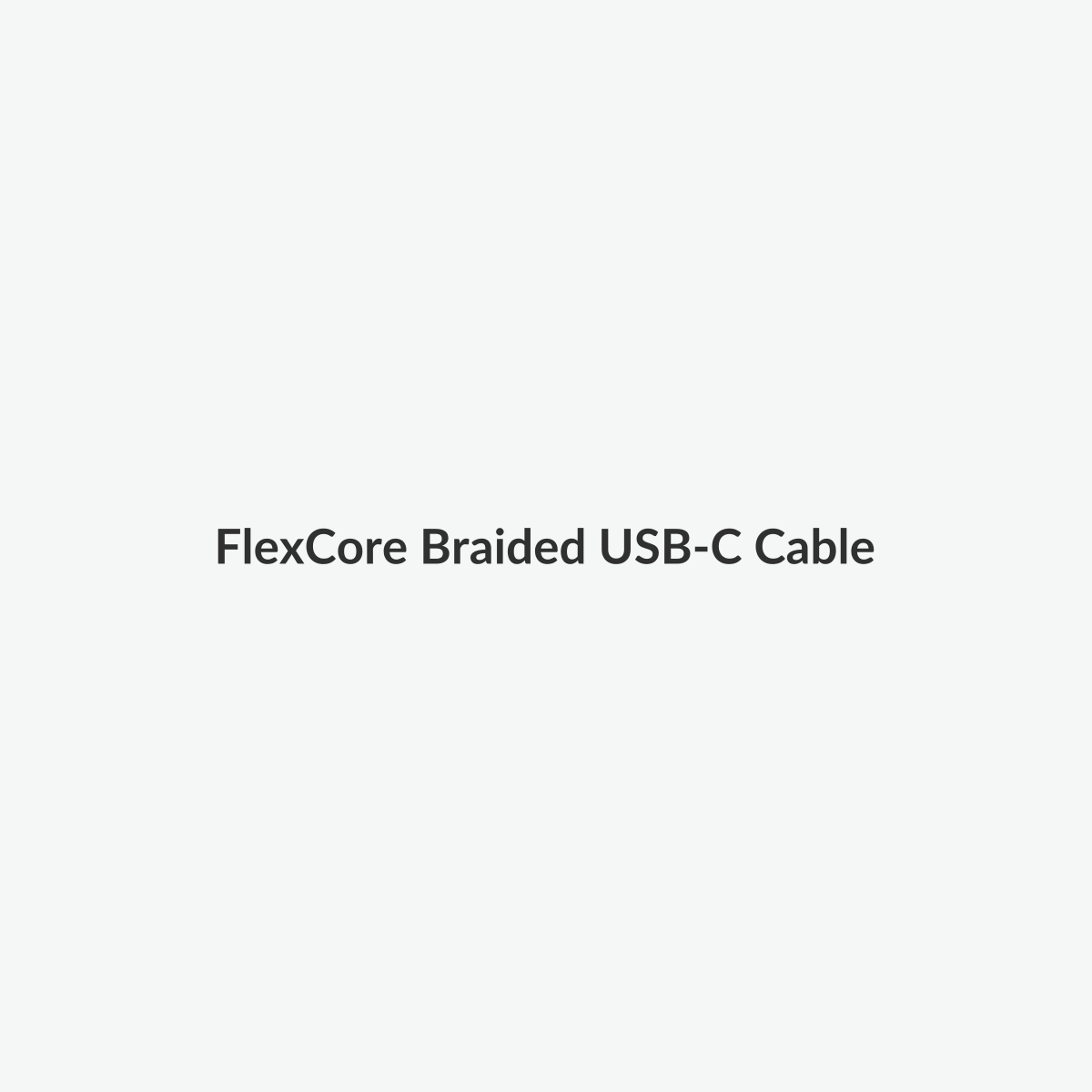 Braided USB-C cable neatly coiled on a light studio background